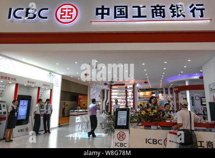 --FILE--People visit the stand of ICBC (Industrial and Commercial Bank of China) during an exhibition in Guangzhou city, south China's Guangdong provi Stock Photo