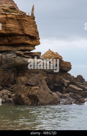 Torres Vedras, Portugal. 06 August 2019. Religious saint statue on a cliff edge in Porto Novo beach in Torres Vedras Portugal Stock Photo