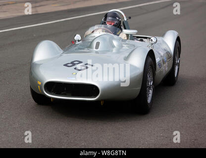 Stephen Bond, driving his 1955 Lister Bristol Flat Iron, down the International Pit Lane, to start the qualifying session for the RAC Woodcote Trophy. Stock Photo