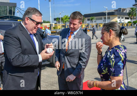 Secretary of State Michael R. Pompeo signs a baseball prior to his departure from Kuala Lumpur, Malaysia, August 3, 2018. Stock Photo