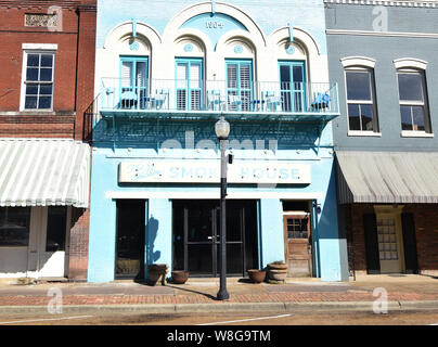 Downtown Yazoo City Mississippi features many buildings painted in pastel colors Stock Photo