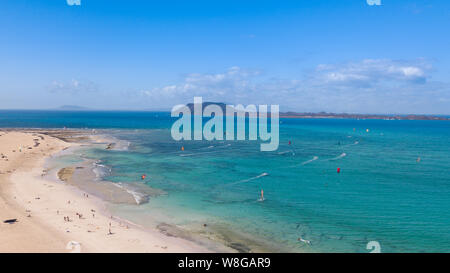 many colorful kites in the Flag Beach on Fuerteventura, Canary Islands Stock Photo