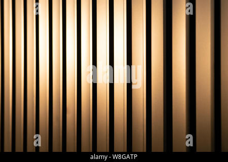 Profiled sheet yellow metal fence. Protection against breaking. Stock Photo