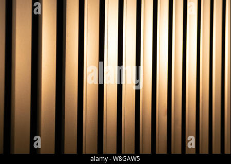 Profiled sheet yellow metal fence. Protection against breaking. Stock Photo