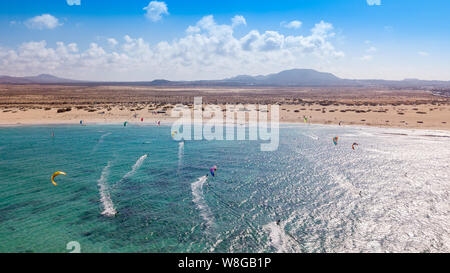 many colorful kites in the Flag Beach on Fuerteventura, Canary Islands Stock Photo