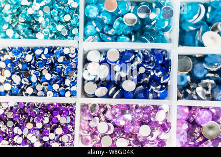 Comparing Craft Rhinestones Color and size variety of rhinestones in the craft box Stock Photo - Alamy