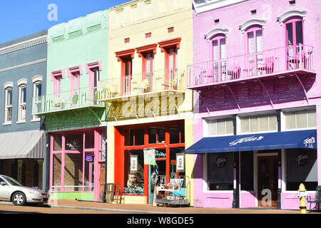 Downtown Yazoo City Mississippi features many buildings painted in pastel colors Stock Photo