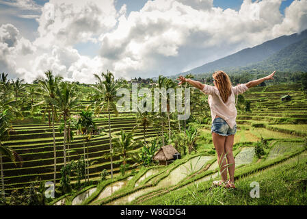 Beautiful  woman looking at beautiful tegallalang rice terrace in Bali, Indonesia Stock Photo
