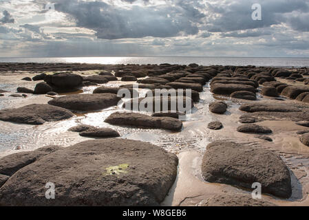 Distinctive large boulders in formation across the sandy beach of Hunstanton, Norfolk Stock Photo