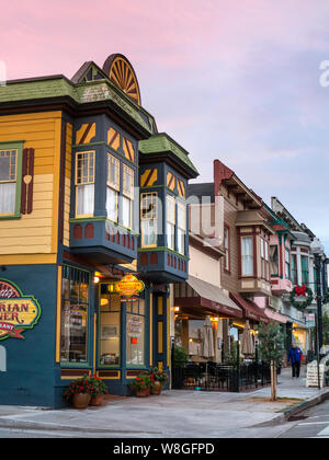 Typical small town American clapboard restaurants and shops at dusk in ...