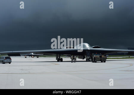 Multiple B-2 Spirits land for aircraft recovery as storm clouds gather Aug. 24, 2016, at Andersen Air Force Base, Guam. Stock Photo