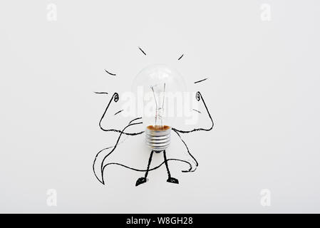 Light bulb isolated on white background with hand drawn doodle illustration on it. Horizontal shot Stock Photo