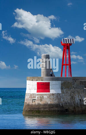 WW2 Monument to the liberation of Europe at the end of the old seawall / sea wall in the harbour at Port-en-Bessin-Huppain, Calvados, Normandy, France Stock Photo