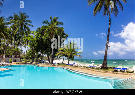 Swimming pool of luxurious african resort and Diani beach seascape in Kenya Stock Photo
