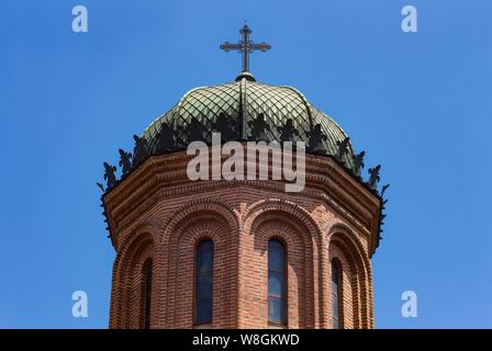 Bucharest, Romania - July 11, 2019: The cupola with cross of the front tower of the church of the Antim Monastery built between 1713 and 1715 by Saint Stock Photo