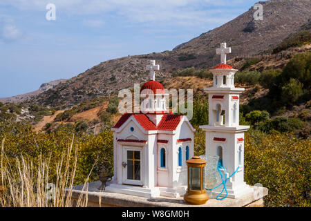 Typical greek miniature roadside shrine. Small Greek orthodox chapel in East Crete Stock Photo