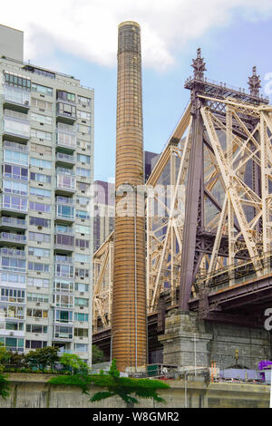 Old Chimney by the Queensboro Bridge viewed from a ferry, New York, Manhattan, USA. Stock Photo