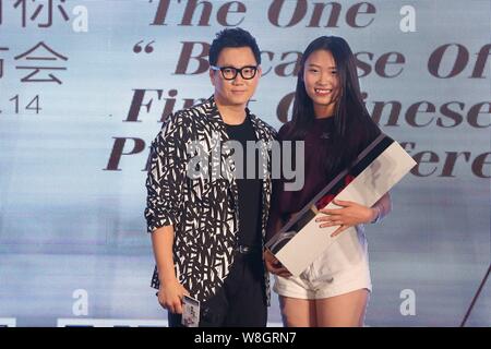 South Korean singer Jeong Soon-won, left, better known by his stage name The One, poses with a fan during a press conference for his Chinese album 'Be Stock Photo