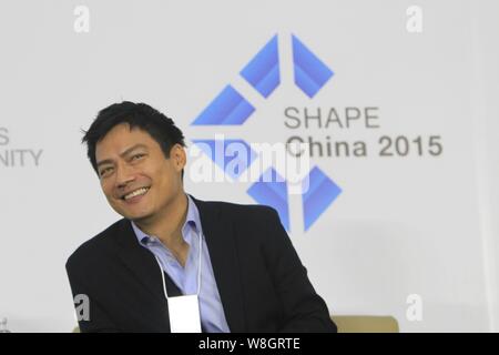 American actor Archie Kao smiles during the 1st 'SHAPE China 2015' summit ahead of the 'Summer Davos' Forum in Dalian city, northeast China's Liaoning Stock Photo