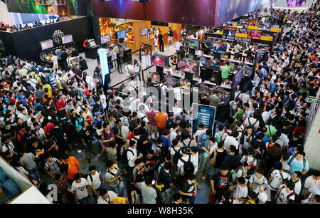 Visitors crowd the 13th China Digital Entertainment Expo, also known as ChinaJoy 2015, in Shanghai, China, 1 August 2015.   More than 273,000 people v Stock Photo