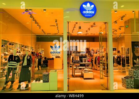 FILE Customers shop at a sportswear store of Adidas in Guangzhou city south China s Guangdong province 23 September 2015. Foreign direct inve Stock Photo Alamy