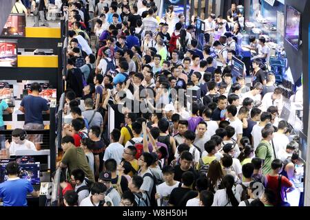 Visitors crowd stands during the 13th China Digital Entertainment Expo, also known as ChinaJoy 2015, in Shanghai, China, 30 July 2015. Stock Photo