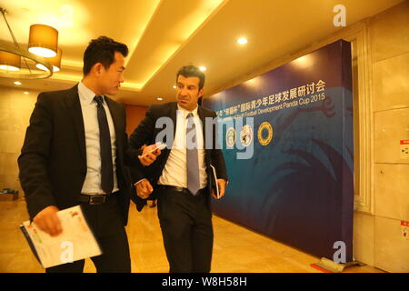 Portuguese football star Luis Figo, right, arrives at the Seminar of International Youth Football Development Panda Cup 2015 in Chengdu city, southwes Stock Photo