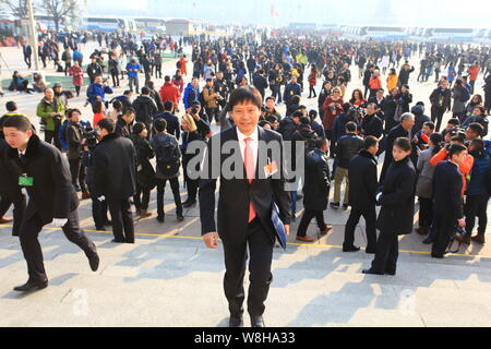 Lei Jun, front, Chairman and CEO of Xiaomi Technology, arrives at the Great Hall of the People to attend the opening meeting of the third Session of t Stock Photo
