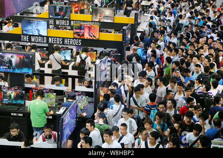 Visitors crowd the 13th China Digital Entertainment Expo, also known as ChinaJoy 2015, in Shanghai, China, 1 August 2015.   More than 273,000 people v Stock Photo