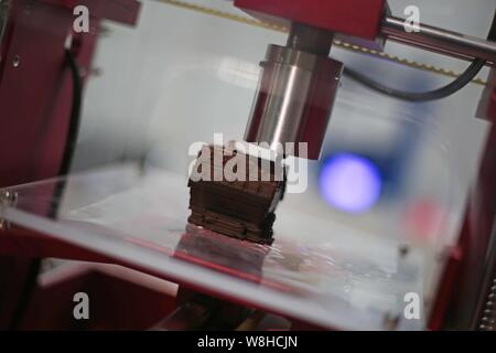 --FILE--A 3D printer is on display during an exhibition in Shanghai, China, 8 December 2015.   Shipment of 3D printers in the Chinese market is expect Stock Photo