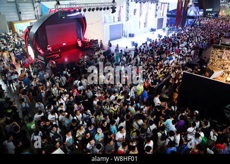 Visitors crowd the 13th China Digital Entertainment Expo, also known as ChinaJoy 2015, in Shanghai, China, 1 August 2015.   More than 273,000 people v Stock Photo