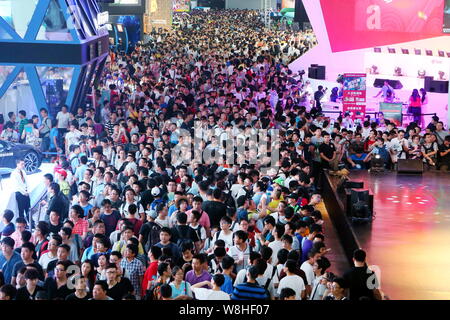 Visitors crowd the 13th China Digital Entertainment Expo, also known as ChinaJoy 2015, in Shanghai, China, 1 August 2015.   More than 273,000 people v Stock Photo