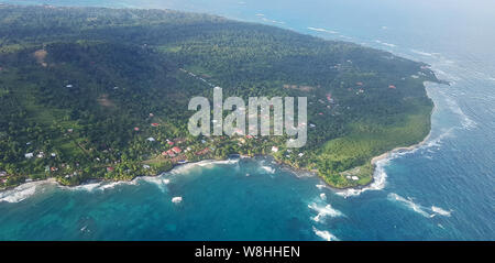 Green island on sunny day aerial drone view