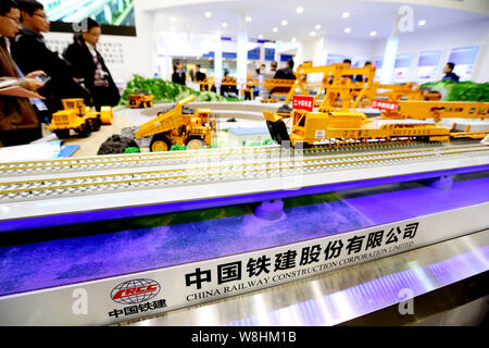 --FILE--Visitors look at models of railway construction machines at the stand of CRCC (China Railway Construction Corporation Limited) at the 7th Inte Stock Photo