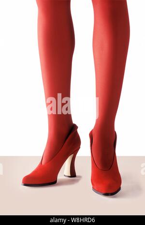 Woman wearing red tights and high heels. Stock Photo