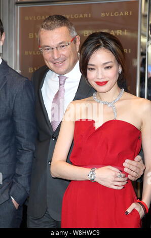 Taiwanese actress Shu Qi, right, poses with Bulgari CEO Jean-Christophe Babin, left, at the opening ceremony for Bulgari's flagship store in Hong Kong Stock Photo