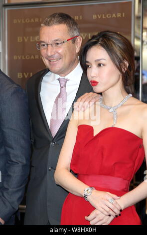 Taiwanese actress Shu Qi, right, poses with Bulgari CEO Jean-Christophe Babin, left, at the opening ceremony for Bulgari's flagship store in Hong Kong Stock Photo