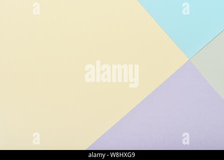 Blue, yellow, green and violet pastel color paper geometric flat lay background Stock Photo