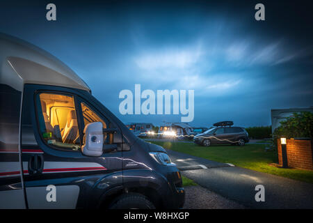 Bude, North Cornwall, England. Friday 9th August 2019. UK Weather. With the forecast stormforce winds and heavy rain hitting the South of England, many campers on one Cornish Campsite decided to pack up and set off home earlier in the day, leaving a few hardy souls to ride out the night in Bude North Cornwall. Stock Photo