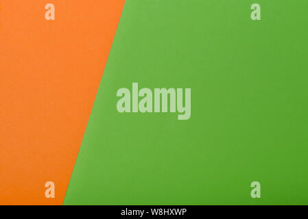 Gren and orange color paper geometric flat lay background Stock Photo