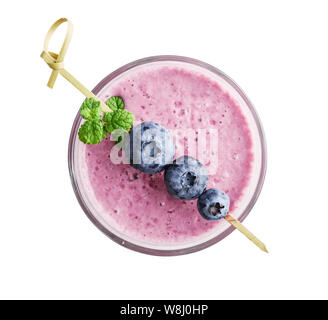 Glass of blueberry milkshake or smoothie with mint leaves isolated on white background, top view Stock Photo
