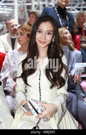 Hong Kong model and actress Angelababy smiles at the Christian Dior fashion show during the Paris Haute Couture Fashion Week Spring/Summer 2015 in Par Stock Photo