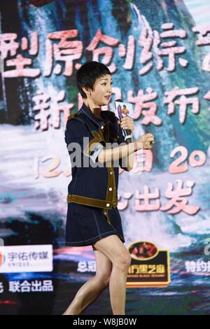 Chinese actress Zhou Xun speaks at a press conference for the film 'On the way' in Hangzhou, east China's Zhejiang province, 10 December 2015. Stock Photo