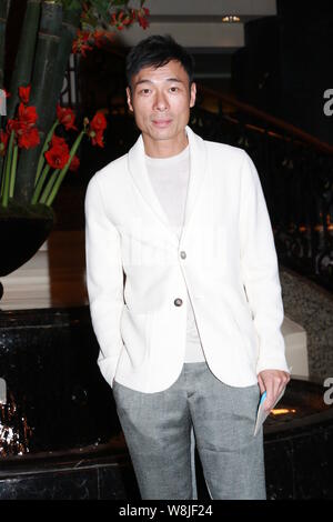 Hong Kong singer Andy Hui poses as he arrives for the wedding party of Hong Kong actor Kenny Bee and his wife Fan Jiang in Hong Kong, China, 22 May 20 Stock Photo