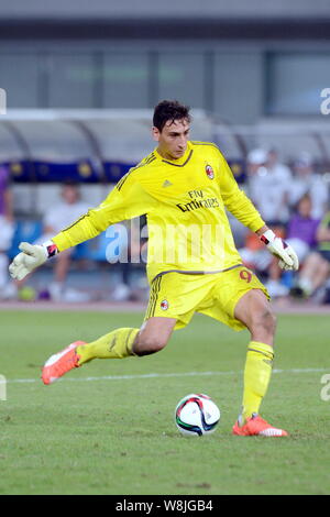Goalkeeper Gianluigi Donnarumma of AC Milan plays a penalty shot ...