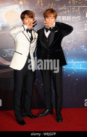 Lee Donghae, left, and Eunhyuk of South Korean pop group Super Junior pose on the red carpet as they arrive for the 15th Huading Award Global Performa Stock Photo