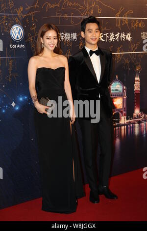 South Korean actress Han Ye-seul, left, and actor Kim Soo-hyun pose on the red carpet as they arrive for the 15th Huading Award Global Performance Cel Stock Photo