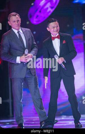 Jack Ma Yun, right, Chairman of Alibaba Group, and English actor Daniel Craig attend the 2015 Tmall 11.11 Global Shopping Festival gala in Beijing, Ch Stock Photo