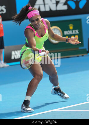 Serena Williams of the United States returns a shot to Madison Keys of the United States in their women's singles semifinal match of the 2015 Australi Stock Photo