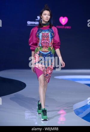 A model displays a new creation at the Qianzi fashion show by French designer MANISH ARORA during the 4th Wuhan International Fashion Week 2015 in Wuh Stock Photo